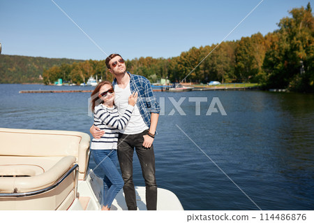 Couple on Yacht. vacation on Boat man and woman. Sailing Sea 114486876