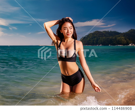 A young woman in a bathing suit 114486908