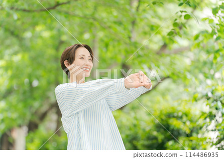 A woman refreshes herself in a new recording 114486935