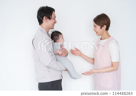 Dad leaving his baby at the nursery 114488263