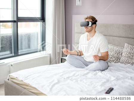 joga with virtual reality. side view photo. technology, sport concept joga with virtual reality. side view photo. technology, sport concept 114488586
