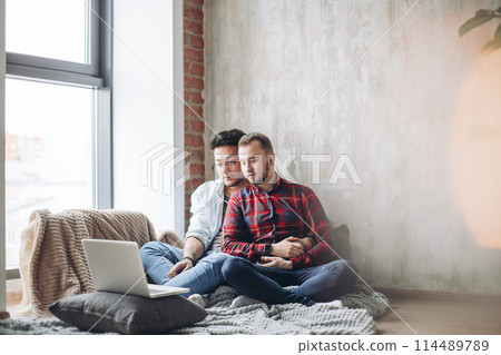 Homosexual partners working at office desk, relationships and business concept Homosexual partners working at office desk, relationships and business concept 114489789