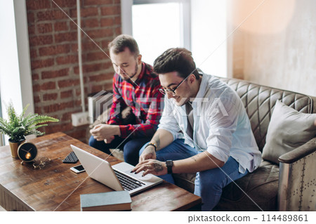 Homosexual partners working at office desk, relationships and business concept Homosexual partners working at office desk, relationships and business concept 114489861
