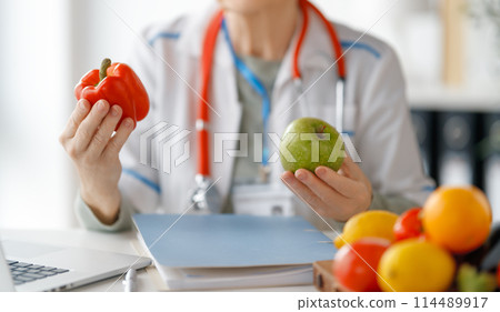 doctor is working in medicine office 114489917