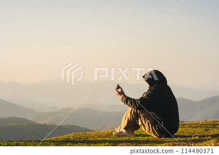 nature traveling with solo man relax and see sunrise with layer of mountain nature traveling with solo man relax and see sunrise with layer of mountain 114490371