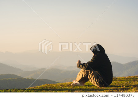 nature traveling with solo man relax and see sunrise with layer of mountain nature traveling with solo man relax and see sunrise with layer of mountain 114490373