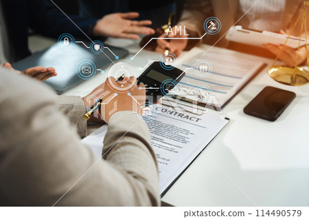 Teamwork of business lawyer meeting working hard about legal legislation in courtroom to help their customer.. 114490579