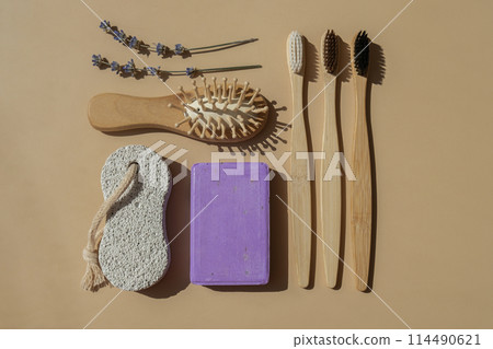 Handcrafted purple lavender soap with lavender flowers. Top view, flat lay. Natural zero waste eco friendly cosmetics. Organic Biodegradable skincare product. Herbal self care wellness alternative Handcrafted purple lavender soap with lavender flowers. Top view, flat lay. Natural zero waste eco friendly cosmetics. Organic Biodegradable skincare product. Herbal self care wellness alternative 114490621