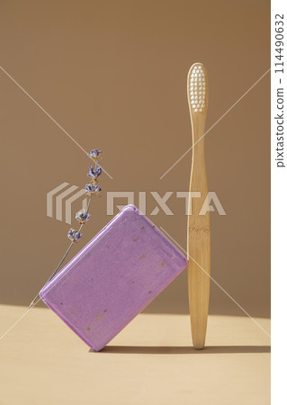 Bamboo toothbrush and Lavender soap on beige background with copy space for your text. Advertisement template mock up. Skincare homemade natural cosmetic concept. Organic dry lavender flower Bamboo toothbrush and Lavender soap on beige background with copy space for your text. Advertisement template mock up. Skincare homemade natural cosmetic concept. Organic dry lavender flower 114490632
