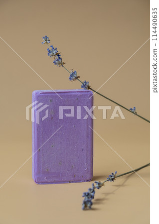 Handcrafted purple lavender soap with lavender flowers. Natural hydrating moisturiser softness cosmetic. Organic calming beauty skincare product. Herbal self care wellness alternative soap Handcrafted purple lavender soap with lavender flowers. Natural hydrating moisturiser softness cosmetic. Organic calming beauty skincare product. Herbal self care wellness alternative soap 114490635