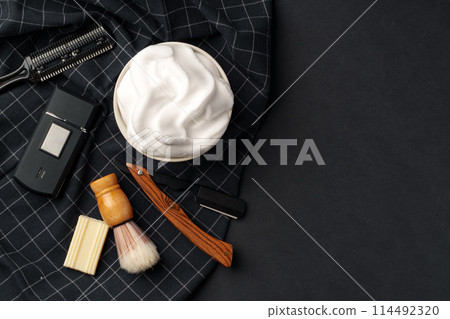 Traditional Wet Shaving Gear Arranged on a Dark Background With Morning Light Traditional Wet Shaving Gear Arranged on a Dark Background With Morning Light 114492320