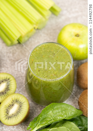 Green smoothie of celery, kiwi, green apple and spinach in a glass Green smoothie of celery, kiwi, green apple and spinach in a glass 114492798