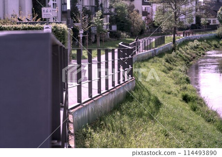 concrete fence with metal fence 114493890