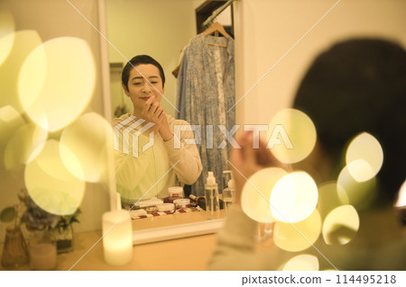 Middle-aged woman doing night skin care 114495218