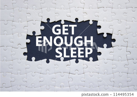 Get enough sleep symbol. White puzzle with words Get enough sleep. Beautiful deep blue background. Healthy lifestyle, medical and Get enough sleep concept. Copy space. Get enough sleep symbol. White puzzle with words Get enough sleep. Beautiful deep blue background. Healthy lifestyle, medical and Get enough sleep concept. Copy space. 114495354