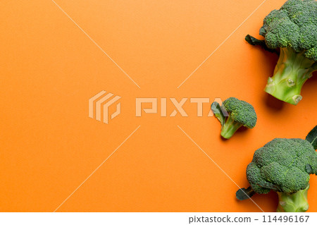 Top view fresh green broccoli vegetable on Colored background. Broccoli cabbage head Healthy or vegetarian food concept. Flat lay. Copy space Top view fresh green broccoli vegetable on Colored background. Broccoli cabbage head Healthy or vegetarian food concept. Flat lay. Copy space 114496167