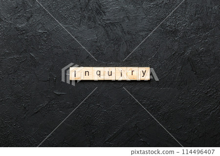 inquiry word written on wood block. inquiry text on table, concept 114496407