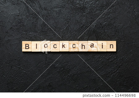 BLOCKCHAIN word written on wood block. BLOCKCHAIN text on table, concept 114496698