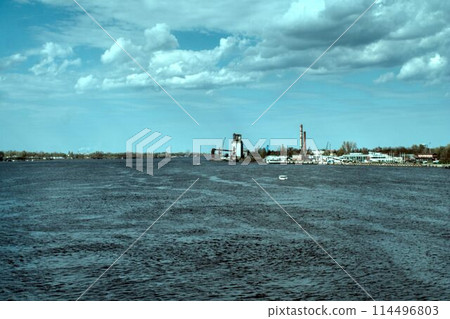 oil refinery river in evening 114496803