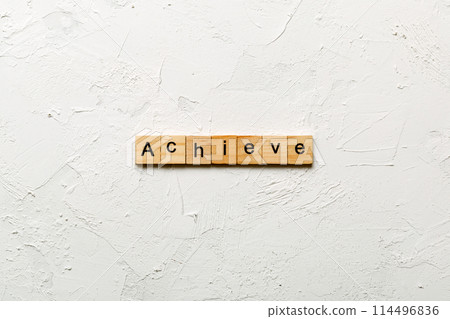 Achieve word written on wood block. Achieve text on cement table for your desing, concept Achieve word written on wood block. Achieve text on cement table for your desing, concept 114496836