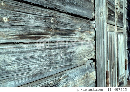 old wooden wall with peeling paint 114497225