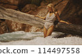 Portrait of a woman with long blond hair on a tropical beach 114497558