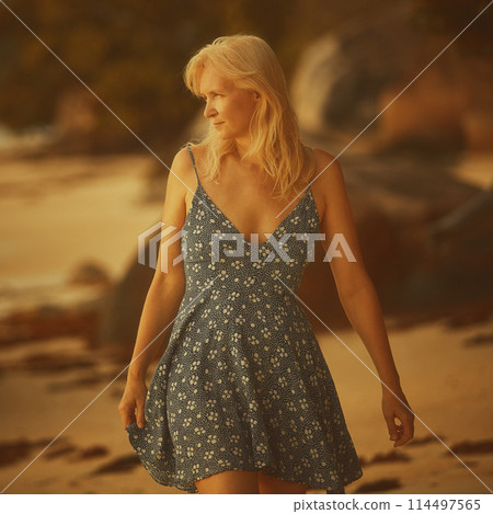 Portrait of a woman with long blond hair on a tropical beach Portrait of a woman with long blond hair on a tropical beach 114497565