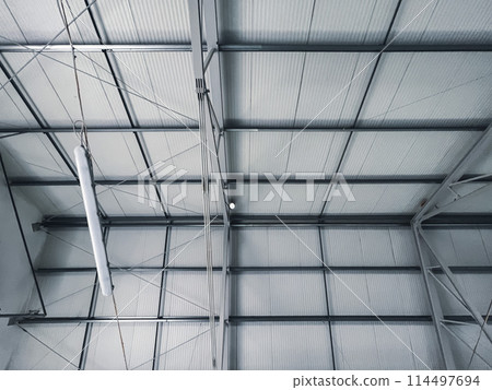 Building frame composition. Steel frame of the building with panels on the roof Building frame composition. Steel frame of the building with panels on the roof 114497694