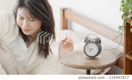woman getting out of bed in the morning 114497817