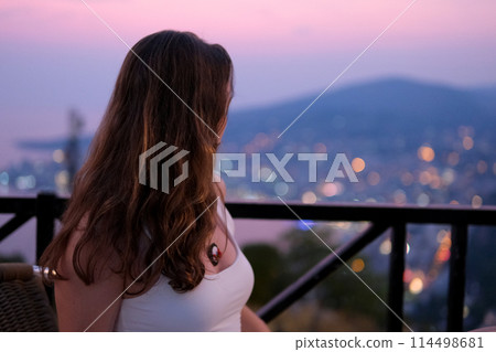 Young girl traveling in Albania attractions beauty nature. Gjirokastra attractions of Albania. Traveling to Albania watching the sights surprised young woman delighted with what is happening around 114498681