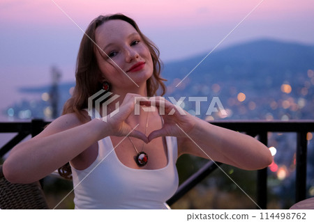Young girl traveling in Albania attractions beauty nature. Woman against the background of Alban view from the mountain evening sunset beautiful body of a young female Young girl traveling in Albania attractions beauty nature. Woman against the background of Alban view from the mountain evening sunset beautiful body of a young female 114498762