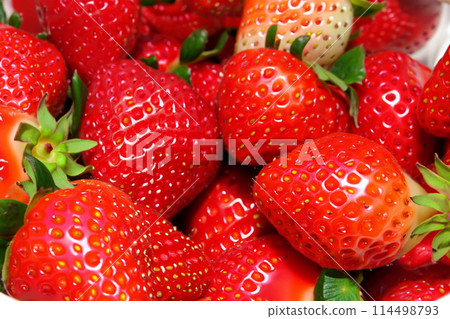 Strawberries. Red large ripe strawberries close-up. Harvest berries. Red strawberries background. Food background. 114498793