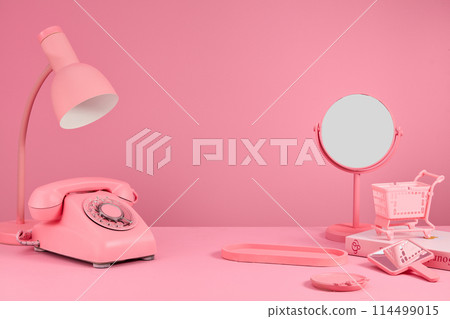 Pink color concept photo with many pink stationary items featured on pink background with empty tray for showing product. Frontal shot with empty space for adding text Pink color concept photo with many pink stationary items featured on pink background with empty tray for showing product. Frontal shot with empty space for adding text 114499015