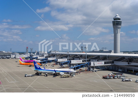 View from the Sky Deck at Chubu Centrair International Airport, control tower and parked domestic passenger planes 114499050