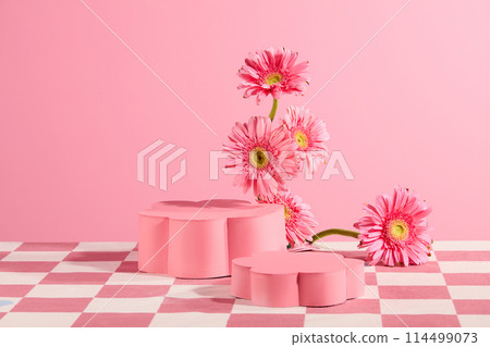 Frontal shot photo for advertise product which made from natural material such as gerbera daisy, empty pedestal in pink color, over light pink texture. Copy space for adding text 114499073