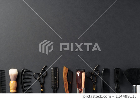 An Assortment of Professional Hairdressing Tools Laid Out on a Dark Surface An Assortment of Professional Hairdressing Tools Laid Out on a Dark Surface 114499113