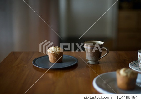 Coffee time with homemade muffins as a snack 114499464