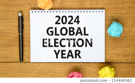 2024 global election year symbol. Concept words 2024 global election year on beautiful white note. Beautiful wooden table background. Paper. Business 2024 global election year concept. Copy space 2024 global election year symbol. Concept words 2024 global election year on beautiful white note. Beautiful wooden table background. Paper. Business 2024 global election year concept. Copy space 114499562