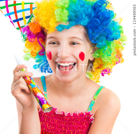Cheerful young little girl in curly clown wig and party horn blower isolated on white background Cheerful young little girl in curly clown wig and party horn blower isolated on white background 114499563