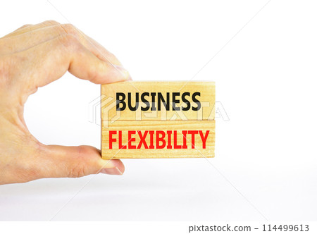 Business flexibility symbol. Concept words Business flexibility on beautiful wooden block. Beautiful white paper background. Businessman hand. Business flexibility concept. Copy space. 114499613