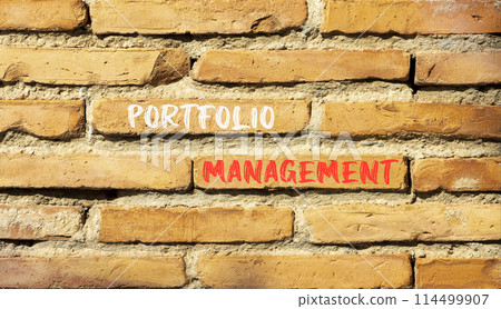 Portfolio management symbol. Concept words Portfolio management on beautiful brick wall. Beautiful red brown brick wall background. Business Portfolio management concept. Copy space. 114499907
