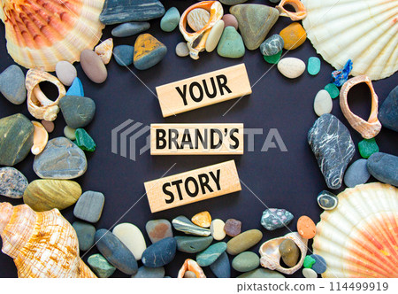 Branding and your brand story symbol. Concept words Your brands story on beautiful wooden blocks. Beautiful black background. Sea shell stone. Business branding your brand story concept. Copy space. 114499919