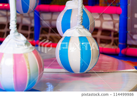 Colorful Inflatable Punching Bags in a Brightly Lit Indoor Play Area Colorful Inflatable Punching Bags in a Brightly Lit Indoor Play Area 114499986