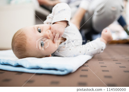 Portrait of cute little baby with fingers in mouth. Portrait of cute little baby with fingers in mouth. 114500000