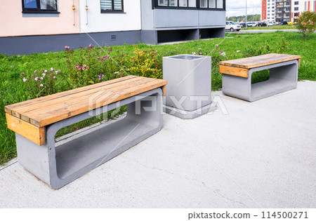 Benches for rest and garbage bin for waste at the city street 114500271