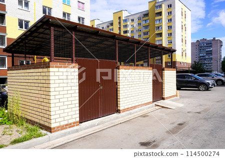 Closed area for garbage containers in the courtyard of a residential building 114500274