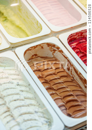 Colorful Assortment of Gelato Flavors in a Display Case at an Italian Ice Cream Shop Colorful Assortment of Gelato Flavors in a Display Case at an Italian Ice Cream Shop 114500328