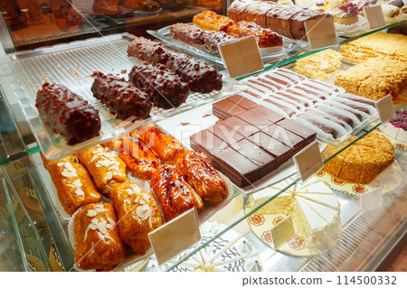 Delectable Assortment of Pastries and Sweets on Display at a Bakery Shop Delectable Assortment of Pastries and Sweets on Display at a Bakery Shop 114500332