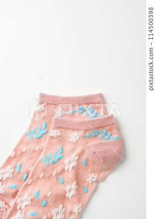 Pink socks with pattern on white background Pink socks with pattern on white background 114500398