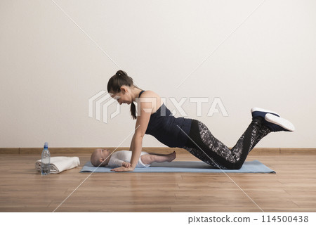 Home exercise for mother and baby, mommy and me workout. Physical activity for mother while bonding with children. Home exercise for mother and baby, mommy and me workout. Physical activity for mother while bonding with children. 114500438